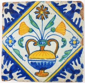 Antique Delft polychrome tile with a richly decorated flower pot, 17th century