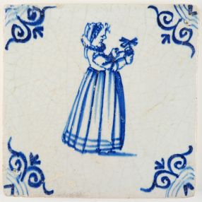 Antique Delft tile in blue with a girl playing with a miniature windmill, 17th century