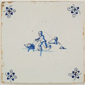 Antique Delft tile with two figures skating on ice, 17th century
