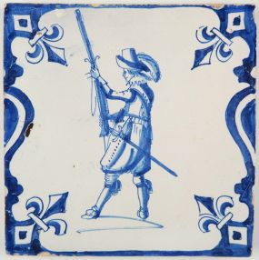 Antique Delft tile with a soldier in blue based on an engraving by Jacob de Gheyn II, 17th century