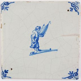 Antique Delft tile depicting a child with a miniature sailing boat, 17th century