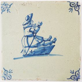 Antique Delft tile with a child on a sledge, 17th century