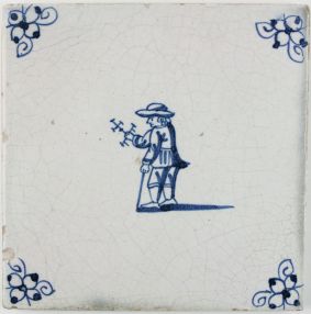 Antique Delft tile in blue with a child playing with a miniature windmill, 18th century