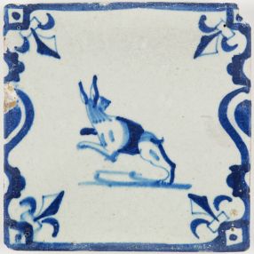 Antique Dutch Delft tile with a beautiful jumping hare in a baluster border, early 17th century
