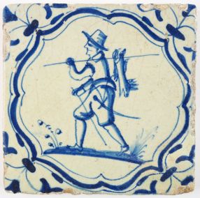Antique Dutch Delft tile with a hunter carrying hunted rabbits, 17th century