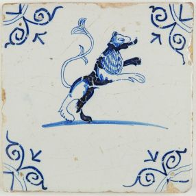 Antique Dutch Delft tile with a beautiful lion standing on his back legs, 17th century