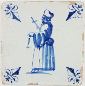 Antique Dutch Delft tile in blue with a priest holding a cross, 17th century