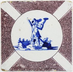 Antique Delft tile with a shepherd in blue decorated with a dizzled circle in manganese, 17th century