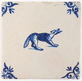 Antique Delft tile in blue with a dog barking viscously, 17th century