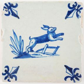 Antique Delft tile in blue with hare jumping over a fence, 17th century