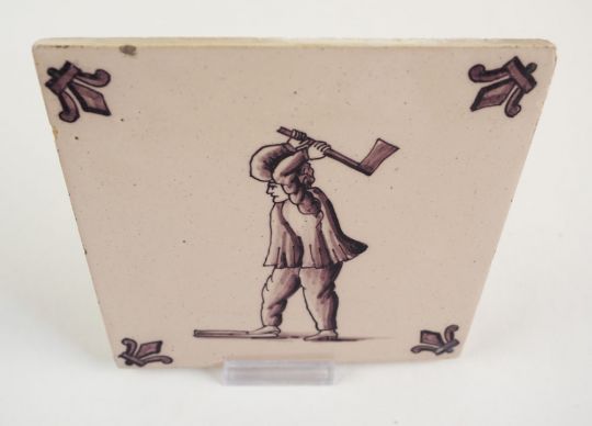Antique Delft tile with a lumberjack, 19th/20th century