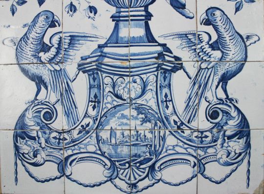 Antique Dutch Delft tile mural with a flower vase and parrots in