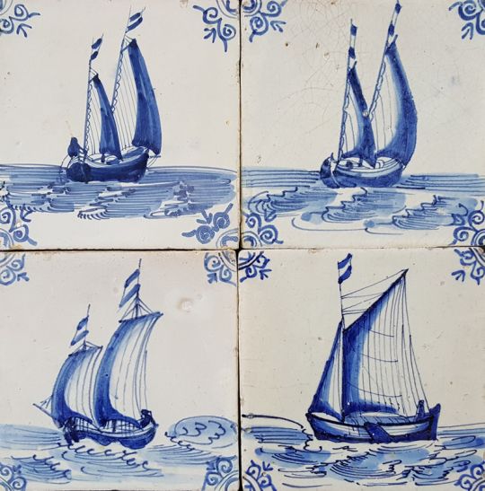 Antique Dutch wall tiles in blue with ships and boats from