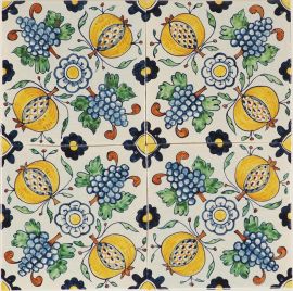 Hand-painted Delft tiles with pommegranates and grapes in polychrome, enhanced with pinholes and a crackled finish
