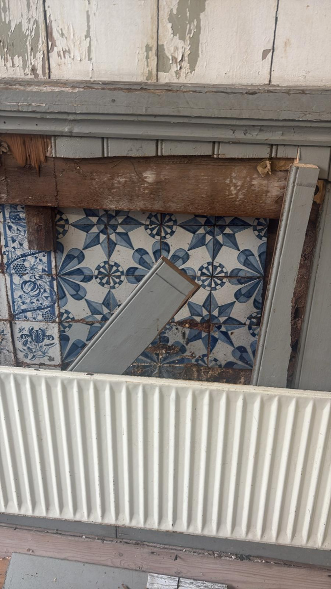 Hidden behind wood panelling, an 18th-century Delft tile wall is revealed in Friesland.
